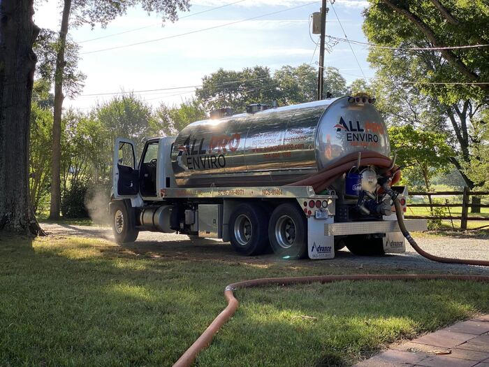All Pro Enviro septic system service at golden hour