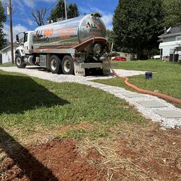 All Pro Enviro pumping a septic tank