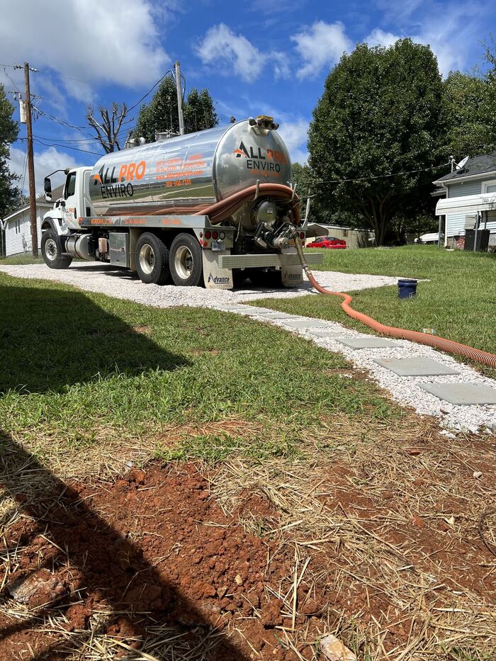 All Pro Enviro crew performing septic pumping service